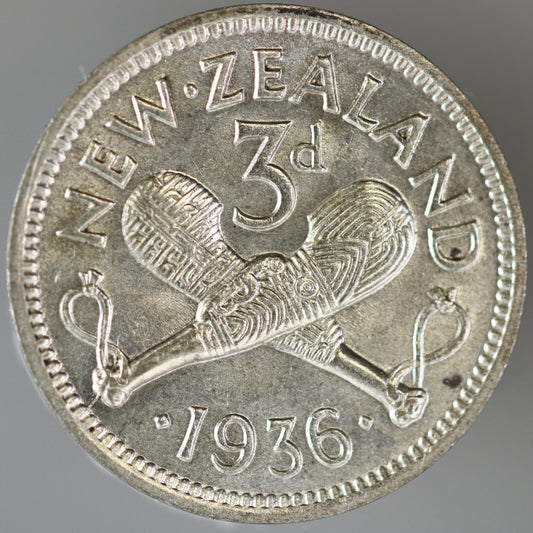 New Zealand 1936 3 Pence featuring two crossed Māori patu (short-handled clubs) A3608