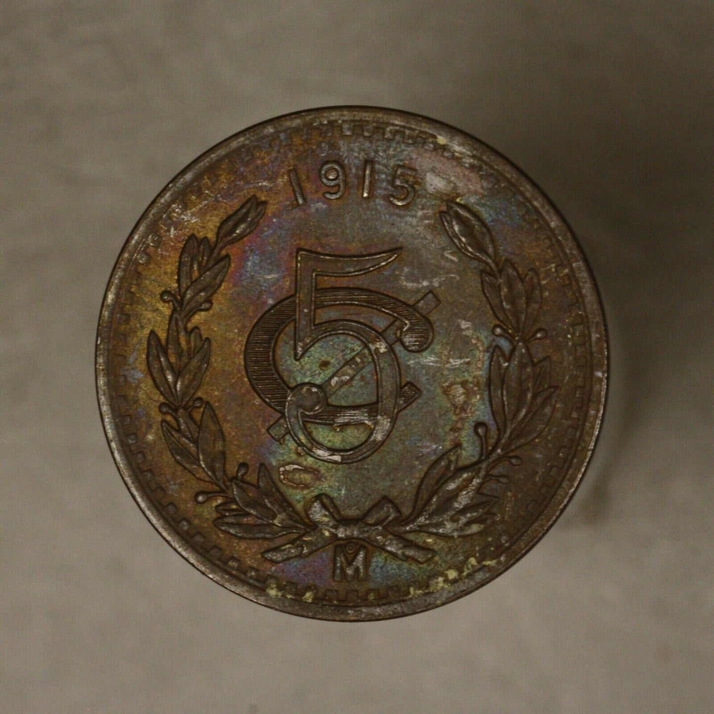 Mexico 1915 5 Centavos dark unc some colored toning on obverse