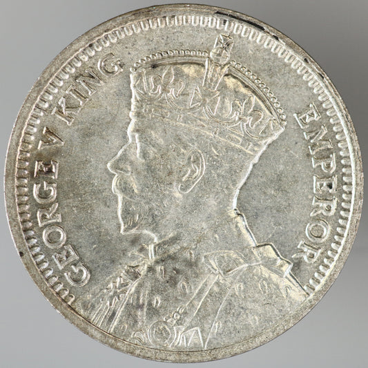 New Zealand 1936 3 Pence featuring two crossed Māori patu (short-handled clubs) A3608