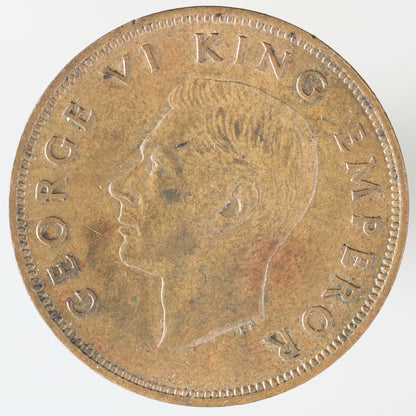 New Zealand 1941 One Penny featuring a tūī bird perched on a kōwhai branch A3607